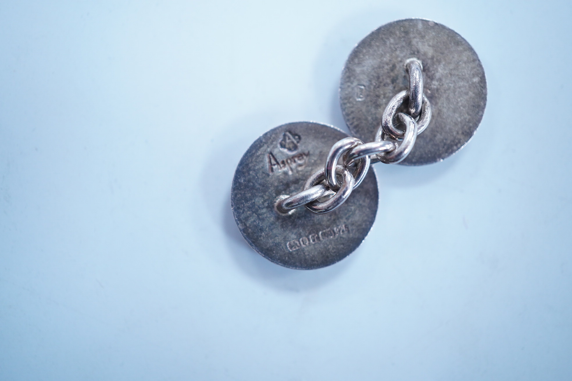 A modern pair of Asprey silver and two colour enamel set target disc cufflinks, in original Asprey box, 14mm. Condition - fair to good